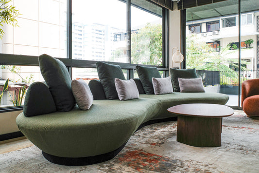 Our biggest curved sofa started on a living room floor, as leftover fabric