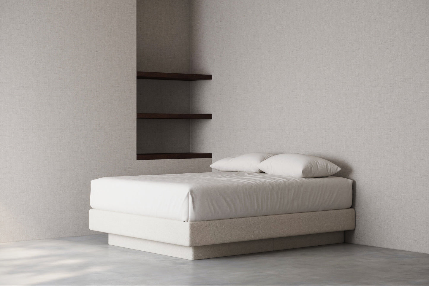 Minimalist bedroom with a bed base against a plain wall